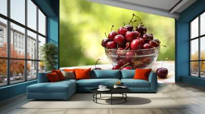 healthy breakfast - sweet cherry in bowl close up photo on green grass background Wall mural