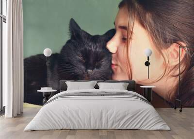 teen pretty girl kiss black cat close up portrait Wall mural