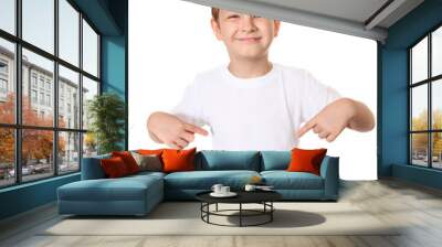 Happy little boy pointing his fingers on a blank t-shirt Wall mural