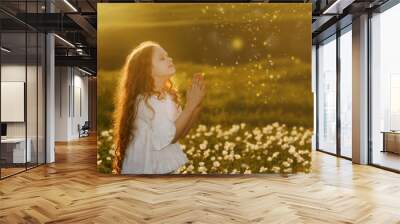 Little girl with praying. Peace, hope, dreams concept. Wall mural