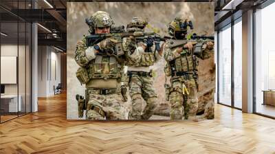 A group of military men in combat gear patrol in the middle of a desert and tropical jungle. Soldiers in full combat gear in dry weather conditions assemble and march on a mission. Wall mural