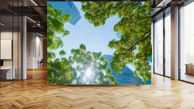 perspective exterior pattern blue glass wall modern buildings with green tree leaves Wall mural