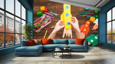 preschool Child in creativity in the home. Happy kid makes rockets from paper. Children's creativity. Creative children play with craft.
Tools and materials for children's art creativity on table. Wall mural