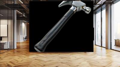 A sturdy hammer on a black background for construction tasks Wall mural