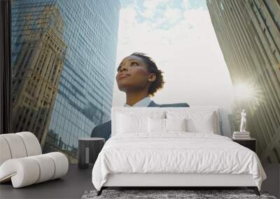 Confident professional african american woman in urban setting. Wall mural