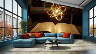 Open book with a glowing atom above it. Wall mural