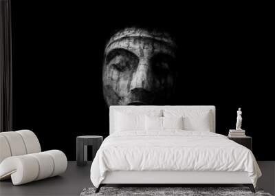 scary stone face isolated on black background Wall mural