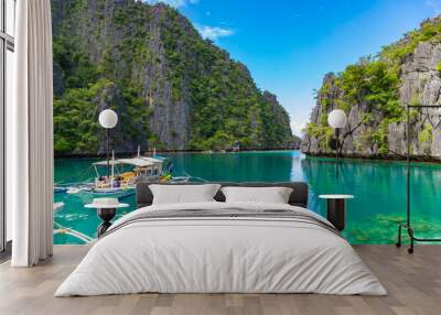 CORON / PHILIPPINES - OCTOBER 31, 2018: Traditional outrigger tourist boats at the landing station for Kayangan Lake. Travel vacation at Philippines. Wall mural