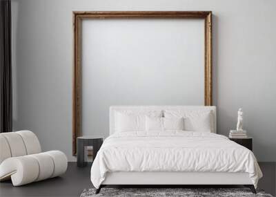 Empty wooden photo frame on a blank white wall mockup template Wall mural