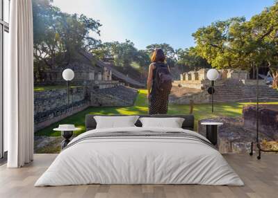 A young girl watching The ball game field in the temples of Copan Ruinas. Honduras Wall mural