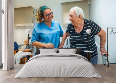 Senior patient doing physiotherapy with help of a therapist Wall mural