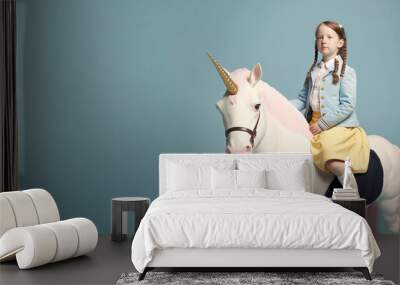 Little School kid dressed in a pastel color clothes, cute suit, on a small pony, a unicorn. Happy girl. Blue background. Illustration. Generative AI. Wall mural