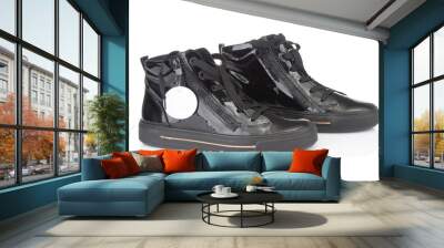 Pair of modern black sport sneakers close up isolated on white background Wall mural