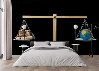 earth and money on a two pan balance Wall mural