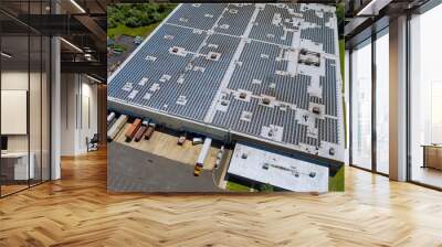 Aerial view rooftop on the solar panel energy for generating electricity with of building warehouse an industrial zone Wall mural