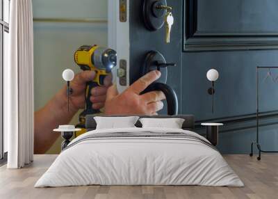 house exterior door with the inside internal parts of the lock visible of a professional locksmith installing or repairing a new deadbolt lock Wall mural