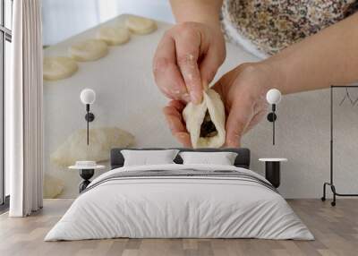 Making homemade buns with potatoes from yeast dough on white countertop in kitchen Wall mural