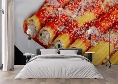 Many manicotti on a white dish plate Wall mural