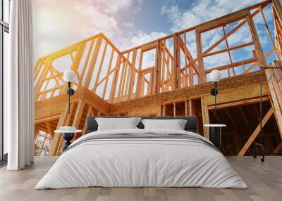 New residential construction home framing against a blue sky. Wall mural