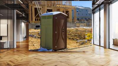 Portable restroom on house under construction in a new house Wall mural