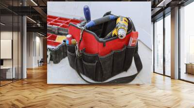 set of tools in a bag on wooden background Wall mural