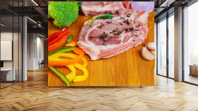 two pieces of raw pork on wooden cutting board ingredients Wall mural