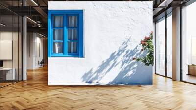 A plain blue shuttered window on a white wall in Naxos Greece
 Wall mural