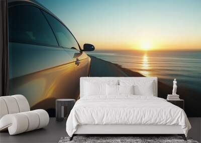 Car cruising along a picturesque seaside road with sun setting over the horizon
 Wall mural