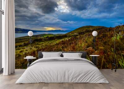 Beautiful scenic landscape of Scotland nature with beautiful evening sun set sky. Wall mural