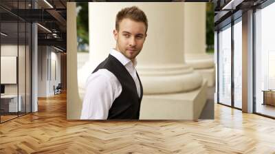 Portrait of a cheerful young businessman Wall mural