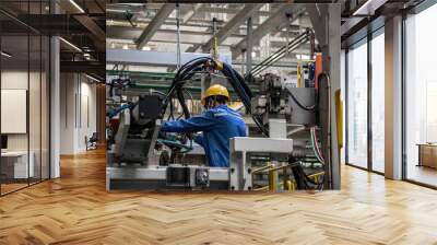 Workers in machinery factory in China. Wall mural