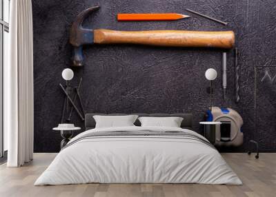 Handyman tools on black textured background Wall mural