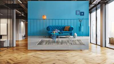 Blue living room, blue sofa and blue home decoration style with orange lamp. Wall mural