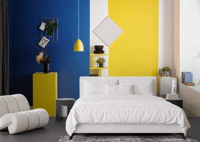 Yellow and blue wall background, interior style, round wood, frame and lamp. Wall mural