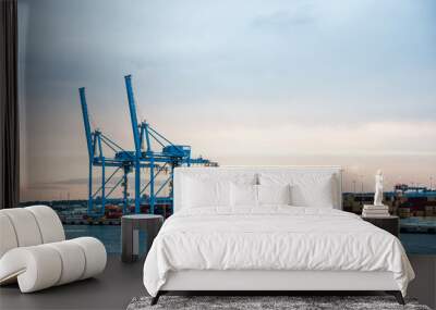 Cranes and containers in industrial port Wall mural