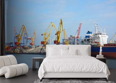 Bulk cargo ship under port crane Wall mural