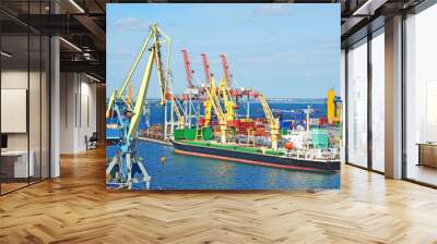 Bulk cargo ship under port crane Wall mural