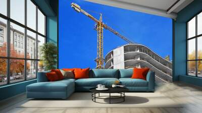 Crane and highrise construction site Wall mural