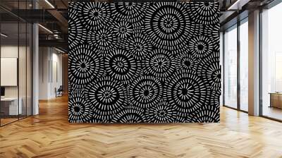 Seamless hand drawn geometric concentric circles pattern. Abstract barnacle or coral sea life motif white stripes on black background. Woodcut sun burst texture in a trendy doodle line art style. Wall mural