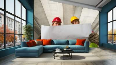 two construction worke or architects, constructing and checking development of a small business hall Wall mural