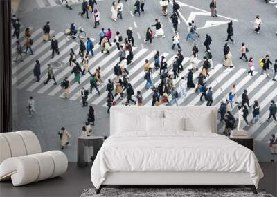 Crowded Japanese people, Asian traveler walk cross road at Shibuya scramble crossing. Tokyo tourist attraction, Japan tourism, Asia transport, commuter transportation or city life concept Wall mural