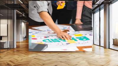 Young Asian creative team work together in business brand design project brainstorm meeting. Modern office, colleague coworker, marketing advertisement research or people teamwork concept. Banner size Wall mural