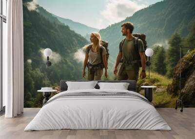 a couple young hiking in the mountains in summer with energetic expression Wall mural