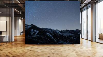 night sky full of stars over snow mountains in winter Wall mural