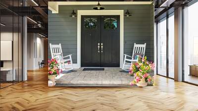 A front porch with two rocking chairs, stamped concrete floors, and double glass doors Wall mural