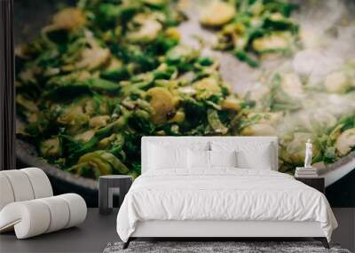 A pan full of  sau·téed shaved brussel sprouts as a vegetarian side dish for dinner Wall mural