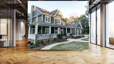 Front view of a large two story blue gray house with wood and vinyl siding Wall mural