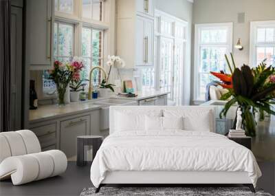 Open Concept Elegant and Spacious Kitchen with Marble Countertops, Chandelier, and Two Toned Cabinets Wall mural