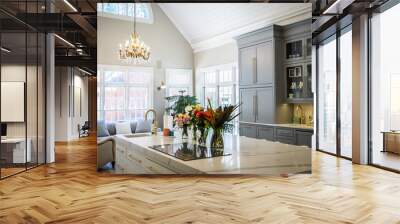 Open Concept Elegant and Spacious Kitchen with Marble Countertops, Chandelier, and Two Toned Cabinets Wall mural