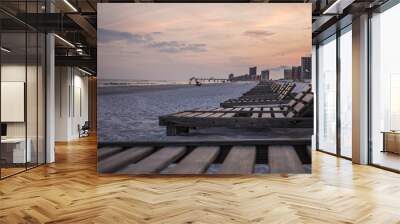 Relaxing wood beach chairs lined up in Orange Beach, Alabama ready for vacation Wall mural